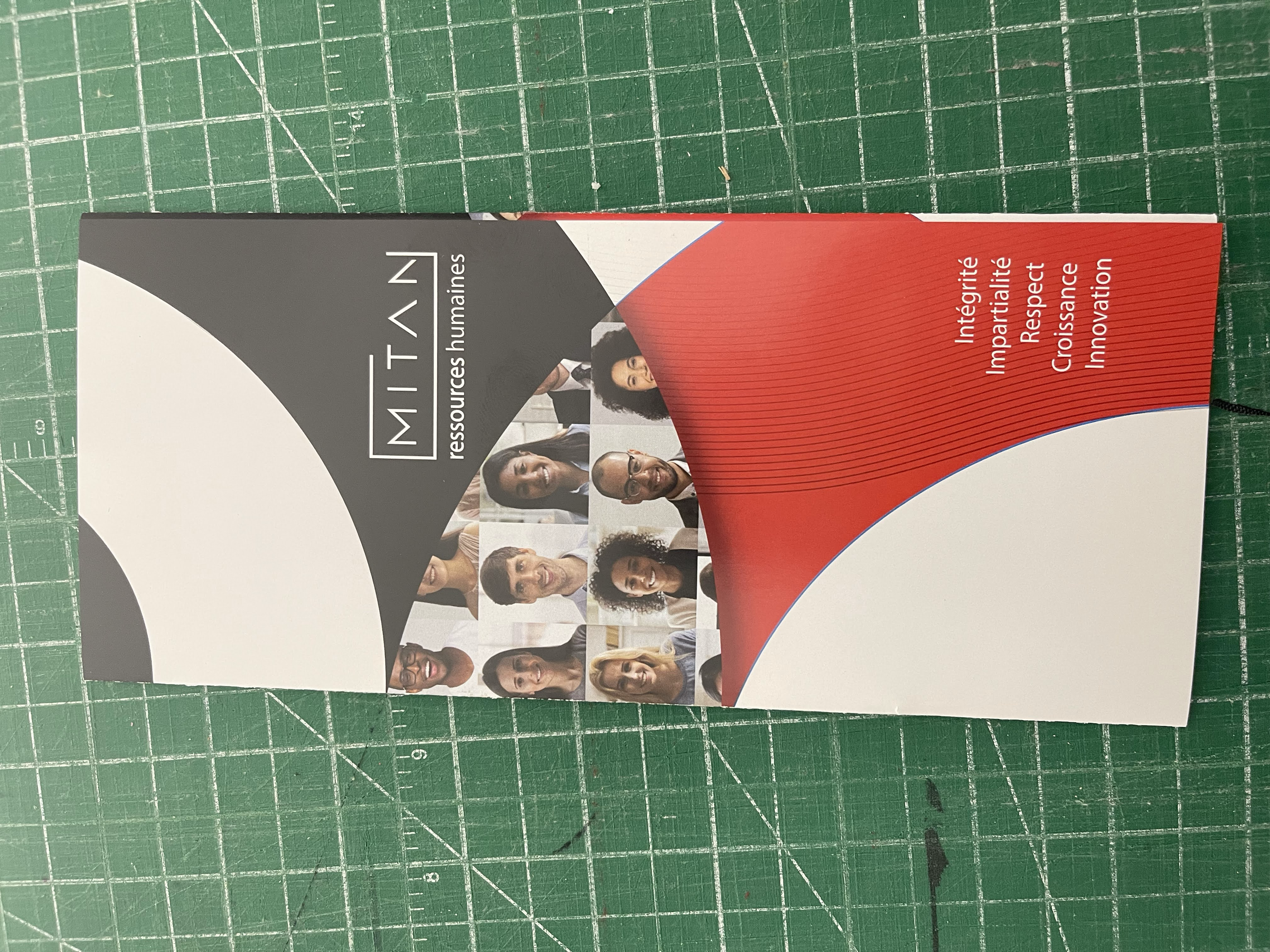 Printed brochure sample on a cutting mat
